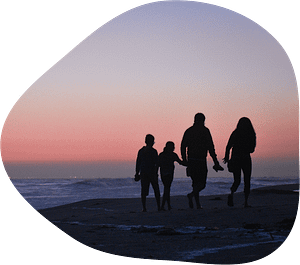 family on beach at sunset with universal life insurance in georgia